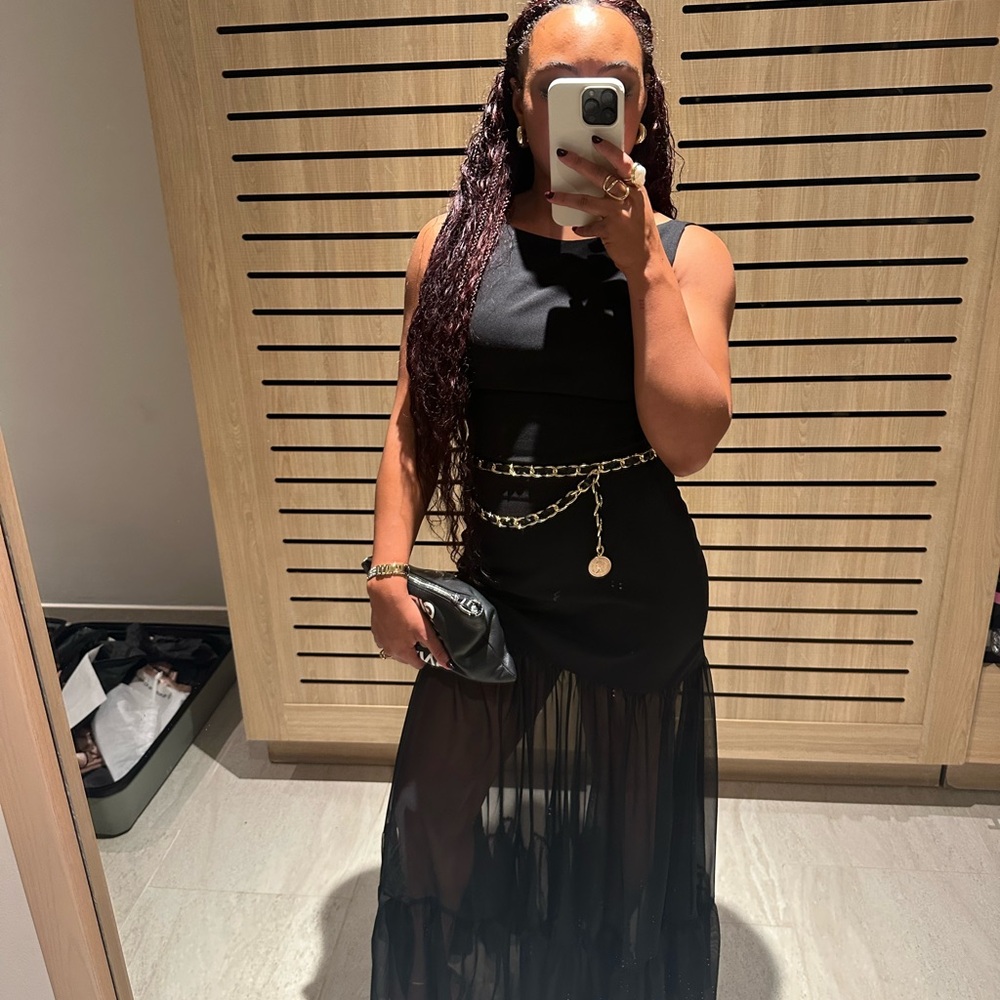 Chic Black Sleeveless Dress with Sheer Skirt